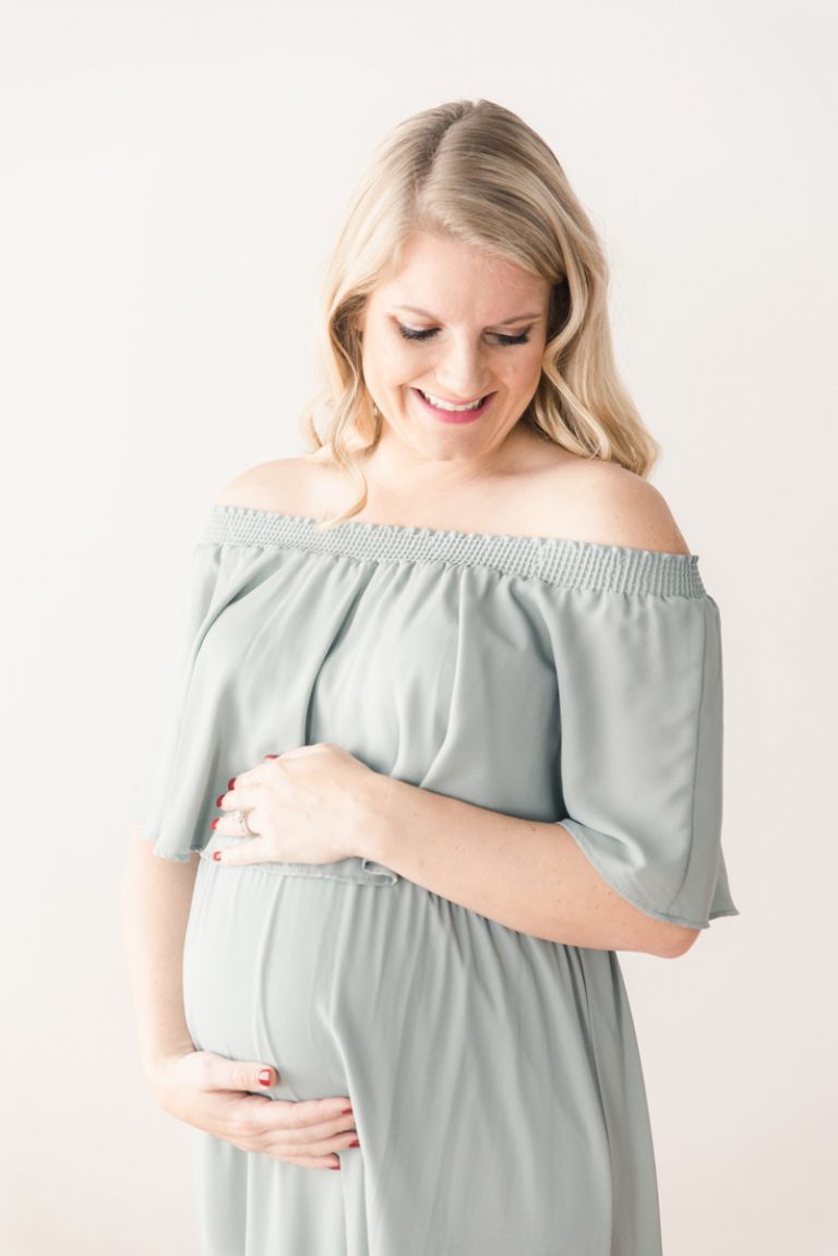 beautiful pregnant mom wearing off the shoulder dress for maternity photos