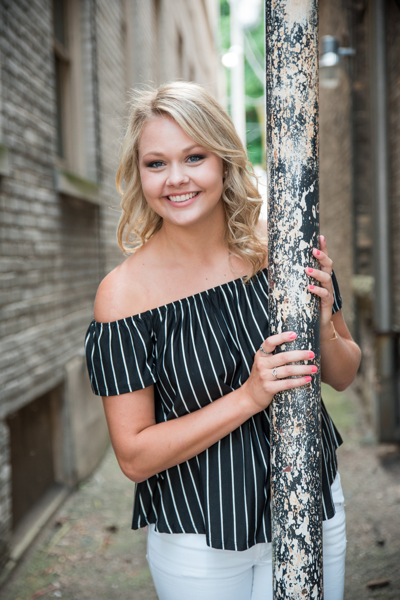 gorgeous high school senior girl in downtown cedar falls by pole