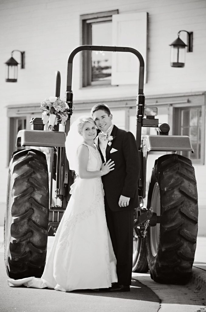 Meghan-and-Joe-Goering-at-Wedding-Reception-with-John-Deere-Tractor