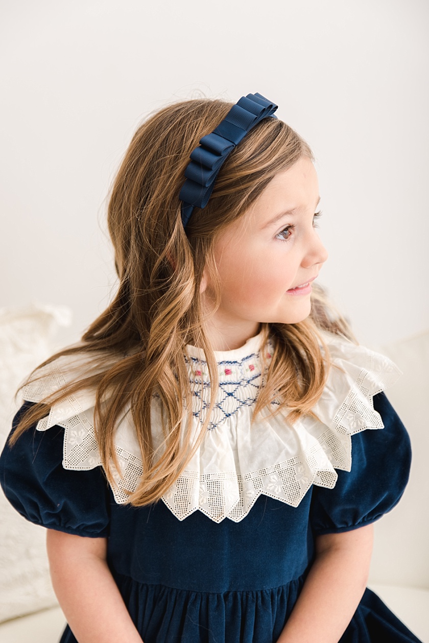 Milestone portrait of 5 year old girl wearing velvet dress in Cedar Falls studio