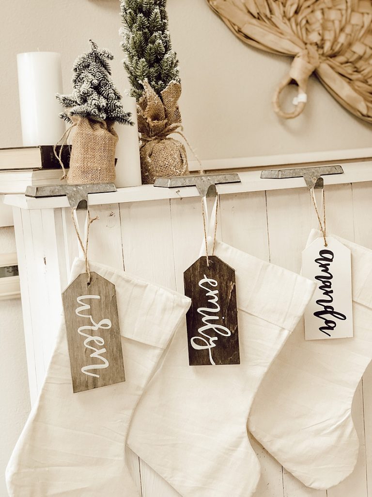 Stockings on a Mantel with Handmade Name Tags by Lotus and Lou Store in Downtown Cedar Falls