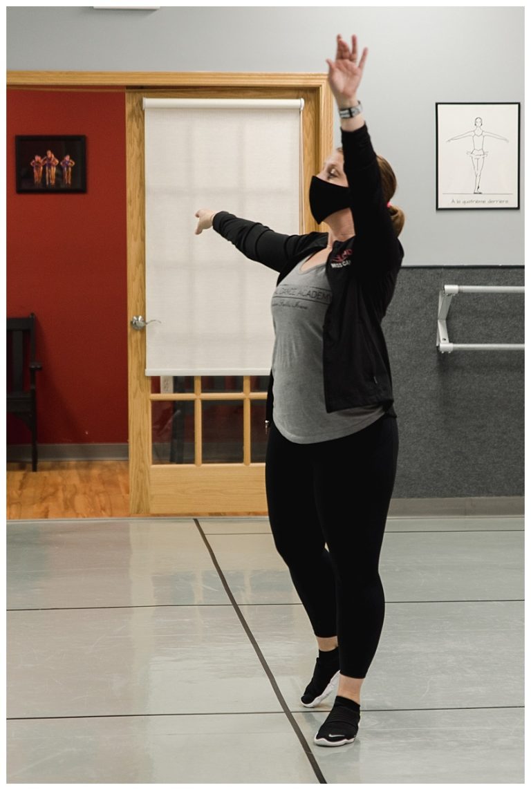 National Dance Academy instructor posing as she leads ballet class