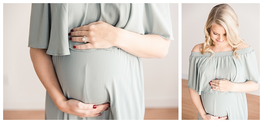 Maternity Client in Natural Light Studio looking down at belly by Meghan Goering Photography