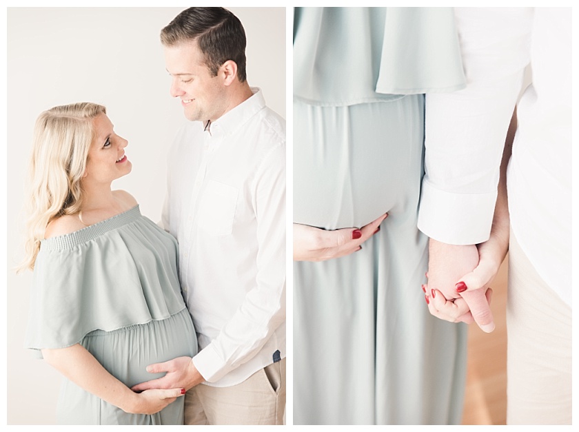 maternity photos with couple holding mama's belly and smiling at each other and holding hands by meghan goering photography