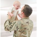 Cedar Falls Military Homecoming Photographer | Father Meets His Son for the First Time
