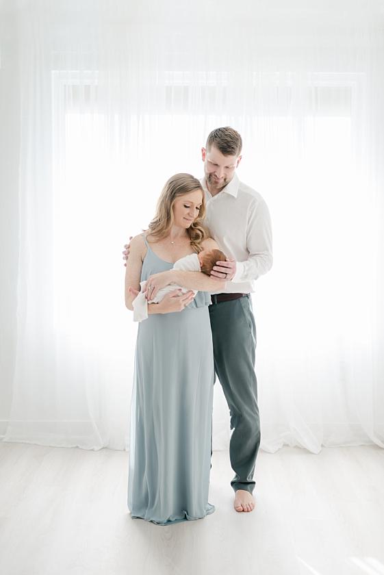 iowa city light and airy newborn photographer captures first time parents adoring baby boy