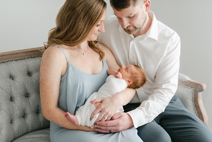 light and airy iowa city newborn photographer captures first time parents