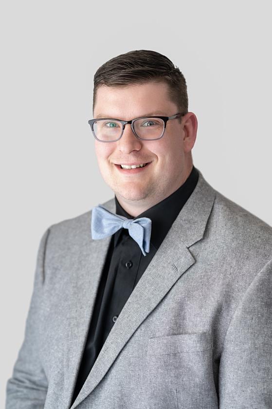 chiropractor headshot of doctor wearing bowtie and suit