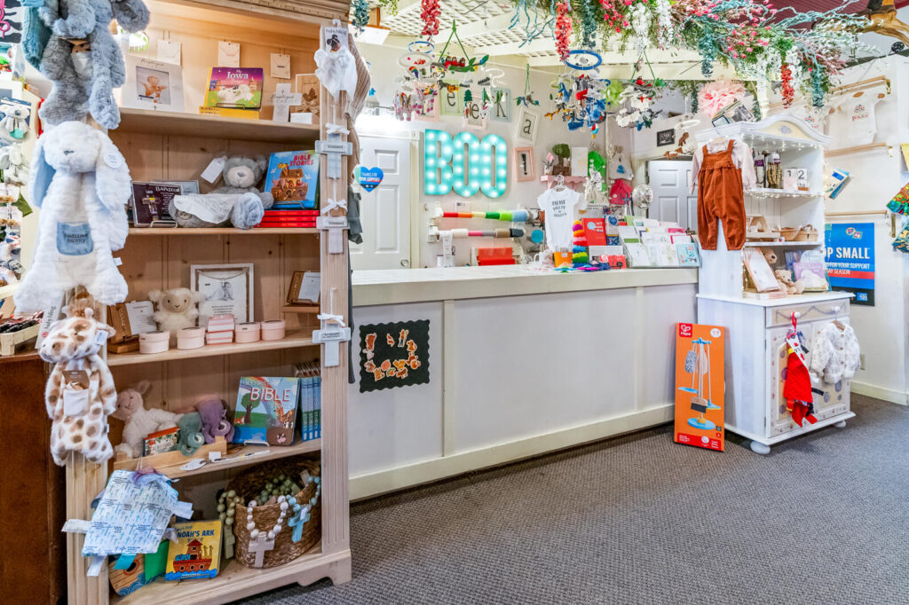 Checkout Counter at Peekabook Baby with communion gifts, nursery mobiles, cards, and more